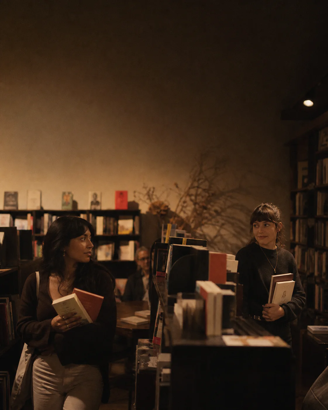Two strangers exchange a glance in an independent bookstore